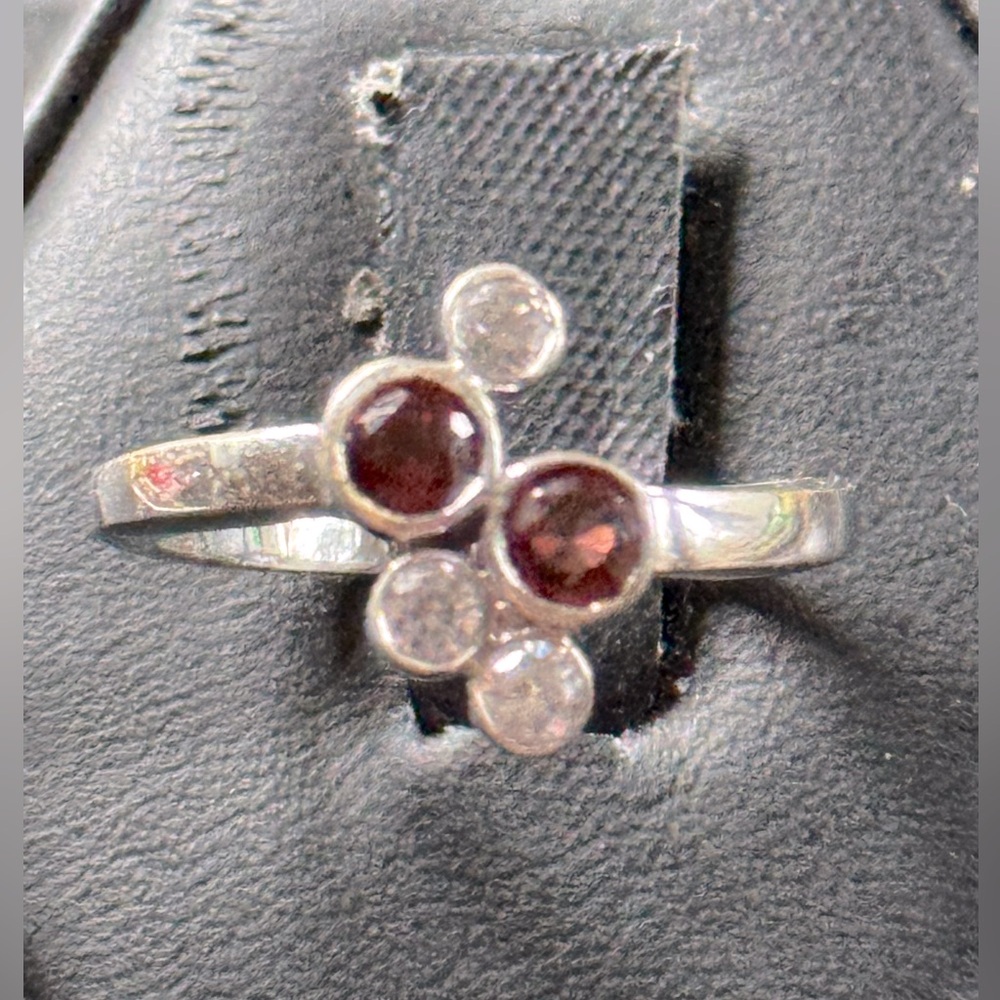 Sterling silver garnet and silver topaz ring